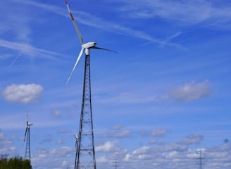 a wind turbine in the middle of a field